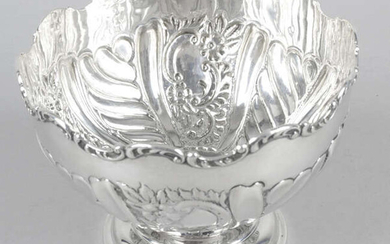 An Edwardian silver small pedestal bowl with embossed decoration.