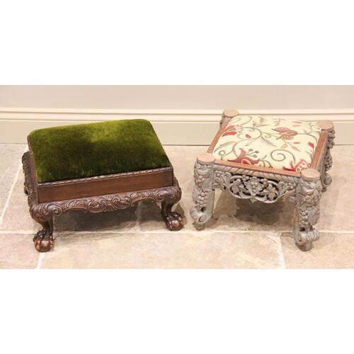 An early 20th century carved walnut foot stool, the velour p...