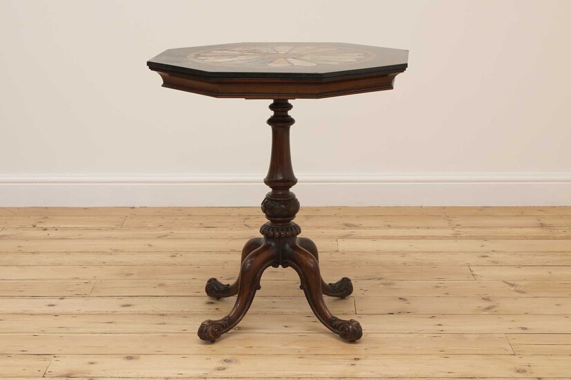 An octagonal walnut and specimen marble-topped table