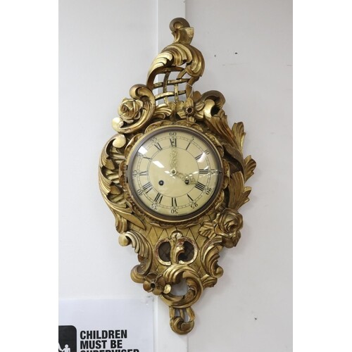 Antique Swedish Rococo gilt wood cartel clock, has key and p...