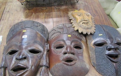 CARVED AFRICAN MASKS, 3 large carved hardwood African masks,...