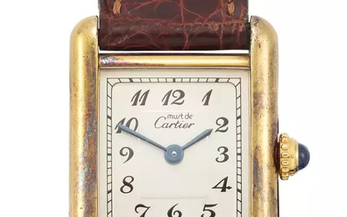 Cartier. A small sized gold plated quartz rectangular wristwatch Must...