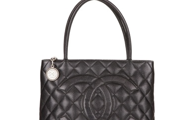 Chanel, a Timeless Medallion tote, crafted from black caviar...