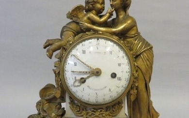 Clock in gilt bronze and white marble about...