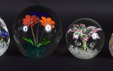 FOUR VINTAGE GLASS PAPERWEIGHTS. Largest 10 cm x 7.5