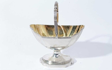 George III silver sugar basket of navette form with reeded borders, swing handle and gilded interior, raised on pedestal foot, (London 1797), maker Thomas England, all at 6.5oz, 13.3cm in length