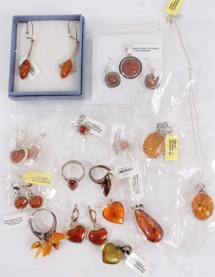 Group of silver and white metal mounted amber jewellery