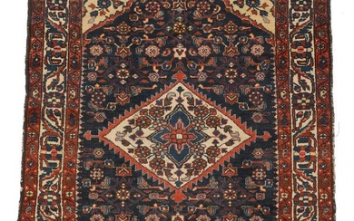 Hamadan rug with a blue field centred by a medallion. 20th century. 143×103 cm.