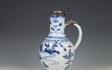 Japan, Arita blue and white silver-mounted porcelain jug, 17th century, the silver later