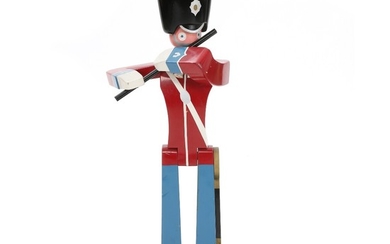 Kay Bojesen: Painted wood guardsman palying a flute. Made by Kay Bojesen. Not marked. Mounted on a green painted base. H. 101 cm.