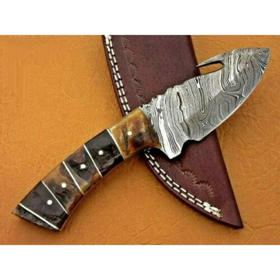 Knife, Damascus steel, ram bone, brass spacer, brass