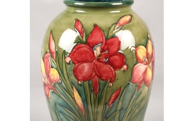 Large Moorcroft pottery vase in the hibiscus pattern, (some ...