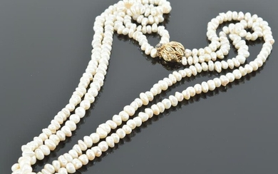 Long Baroque pearl and gold double strand necklace. 14