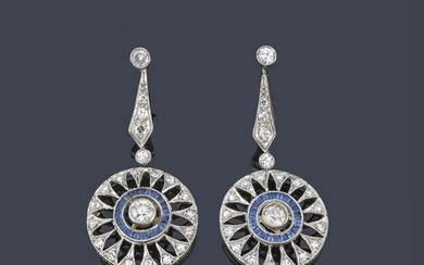Long earrings with diamonds and sapphires in platinum.