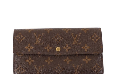 NOT SOLD. Louis Vuitton: A "Porte Monnaie Credit" wallet of brown monogram coated canvas with...