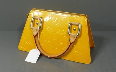 Louis Vuitton yellow patent leather bag Trapeze model with cover