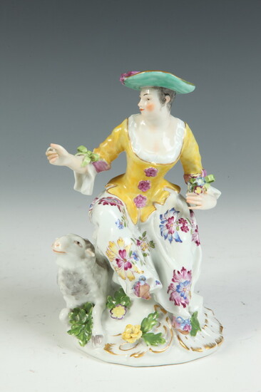 MEISSEN POLYCHROMED PORCELAIN FIGURE MODELED AS SEATED MAIDEN WITH SHEEP,...