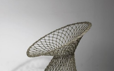 Marcel WandersA “Fishnet Chair”, designed by Marcel Wanders...