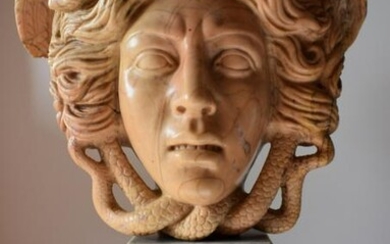 Medusa, in antique yellow marble from the late 19th