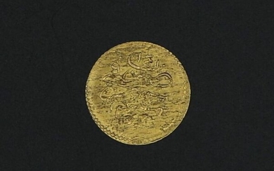 Monnaie étrangère en or - 0.42 g / Ø. 13 mm