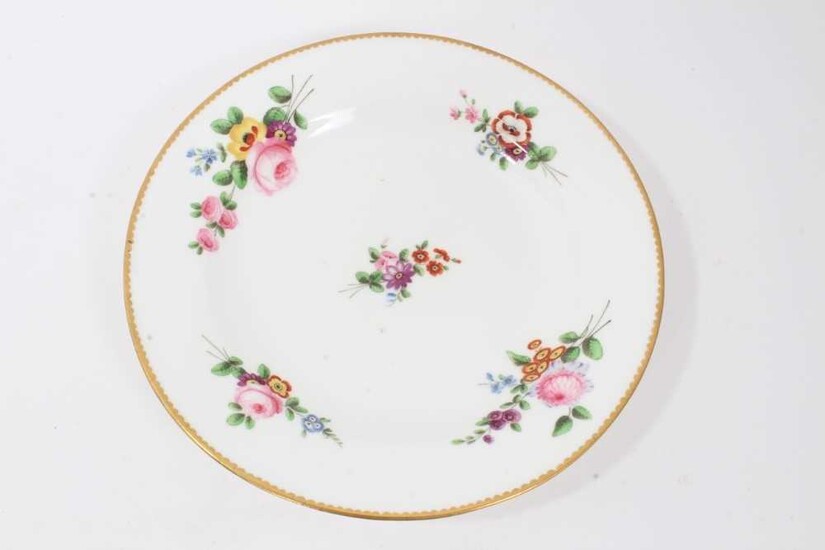 Nantgarw plate, circa 1817-20, polychrome painted with flowers with gilt rim, impressed mark to base, 21cm diameter