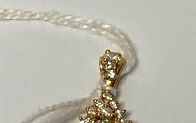 PENDENTIF en or jaune 18K (750 millièmes) orné d'un diamant taillé en brillant calibrant 0.70...