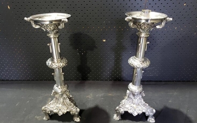 Pair of Chrome or Nickel-Plated Ecclesiastical Candlesticks, with foliate rings, on a footed triform base with grapevines (h:40cm)....