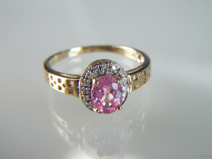Solitaire oval Pink Topaz with Diamond accents set in a 9ct ...