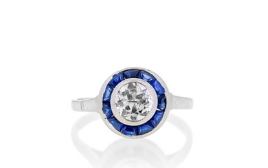 Solitaire ring in platinum, sapphires and diamond