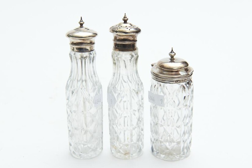 THREE SILVER MOUNTED VICTORIAN CONDIMENT BOTTLES INCLUDING A MUSTARD POT, THE TALLEST 14.5 CM HIGH, LEONARD JOEL LOCAL DELIVERY SIZE...