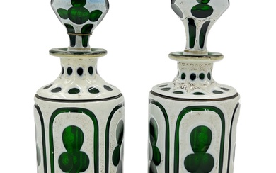 TWO OVERLAID BOHEMIAN GREEN GLASS BOTTLES, 19TH CENTURY A...