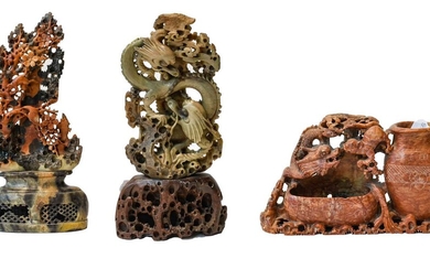 Three modern Chinese soapstone carvings, two depicting dragons, the...