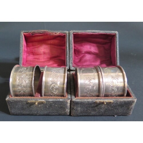 Two George V Cased Pairs of Silver Napkin Rings with chased ...