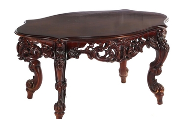 (-), Walnut color coffee table with richly carved...