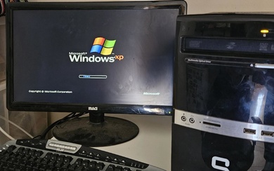 Windows XP desktop computer with a screen in working mode