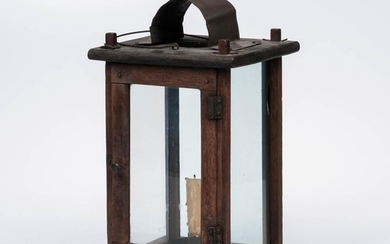 Walnut and Tin Barn Lantern, America, 19th century, with four windows, tin candle socket, arched tin smoke shield, and iron wire bail