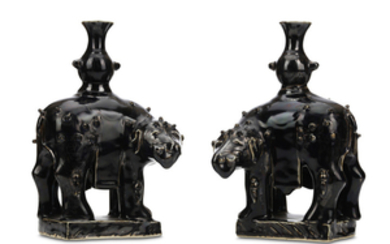 A PAIR OF CHINESE BLACK-GLAZED ELEPHANTS. Qing Dynasty,...