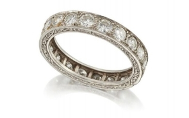 A platinum, diamond eternity ring, set with...