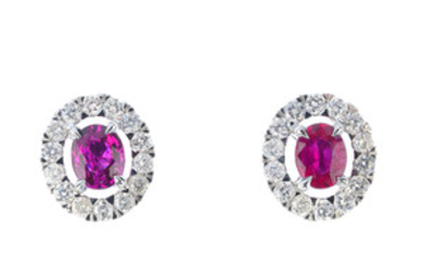 A pair of ruby and diamond cluster earrings. View more details