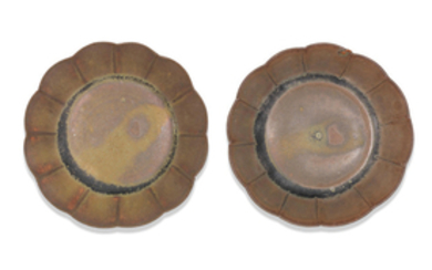 A rare pair of small brown-glazed saucer dishes