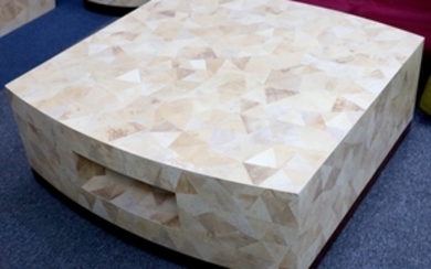 A contemporary coffee table manufactured by Nature Squared,...