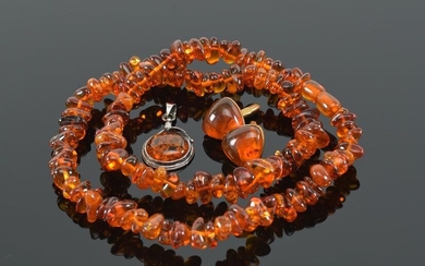 4 pieces of amber jewelry. 1) Sterling silver art
