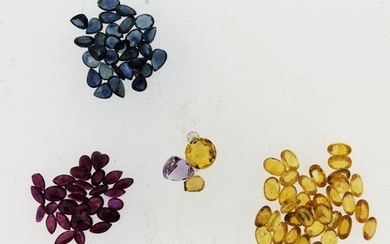 Quantity of loose gemstones, including yellow sapphires, blue sapphires and rubies