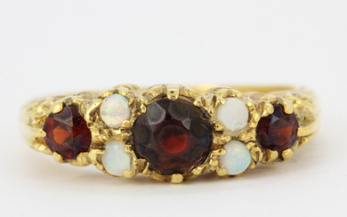 9CT, GARNET AND OPAL RING.