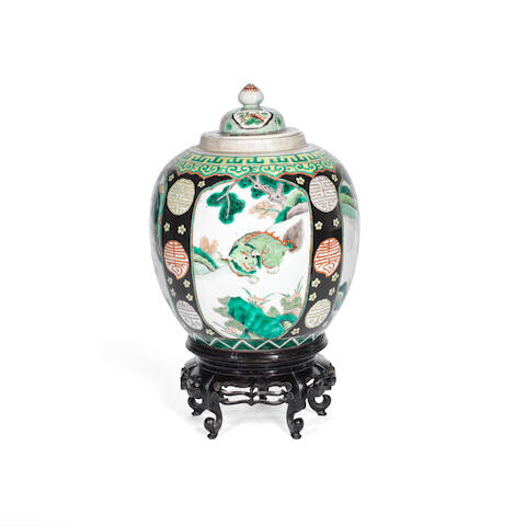 A 19th century Chinese porcelain Famille vert vase with matched cover