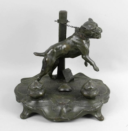 A 19th century cast metal desk stand, modelled as a