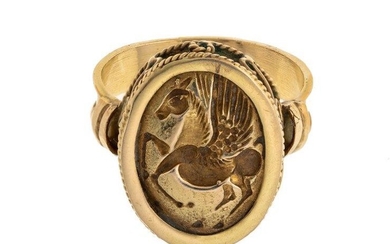 A 19th century gold intaglio ring, the oval bezel with engaved intaglio depicting Pegasus, engraved after the ancient, within fancy wirework border, ring size R
