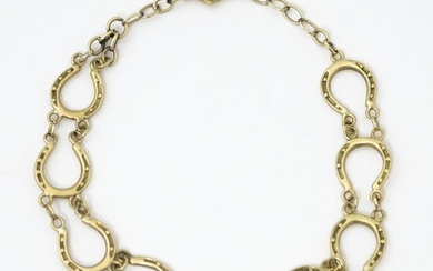 A 9ct gold bracelet with horseshoe detail. Please Note - we do not make reference to the condition