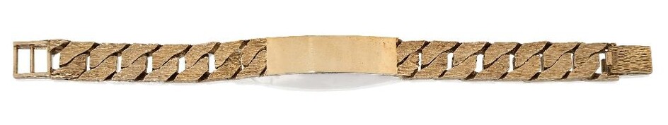 A 9ct gold name bracelet, with textured flat curb links to a blank rectangular name panel, London hallmarks, 1979, approx. length 21cm, gross weight approx. 69.4g