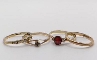 A 9ct gold, red stone and diamond ring, a half eternity ring...